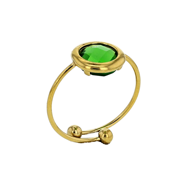 Bague réglable ornée d'un rond en verre facetté bleu marine, acier doré
