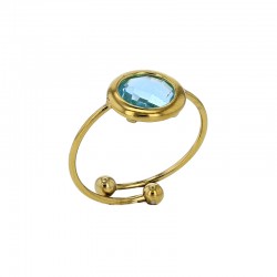 Bague réglable ornée d'un rond en verre facetté bleu marine, acier doré