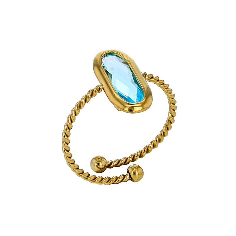 Bague réglable torsadé orné d'un ovale en verre facetté rouge, acier doré