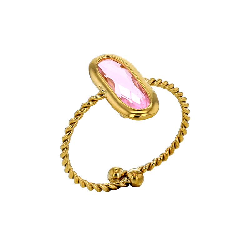 Bague réglable torsadé orné d'un ovale en verre facetté rouge, acier doré