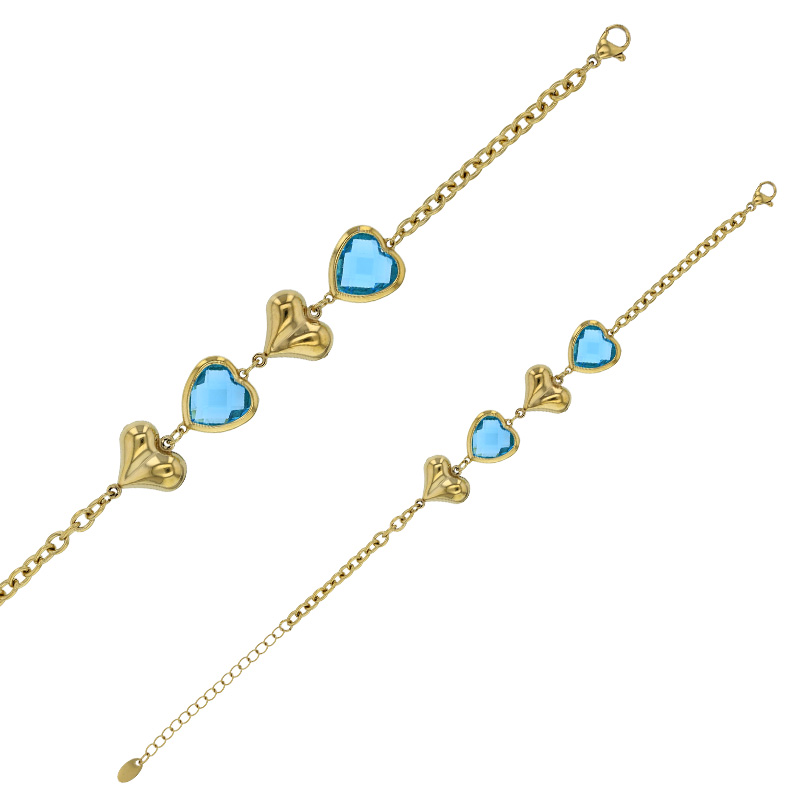 Bracelet orné de coeurs bombés et verre facetté bleu clair, acier doré