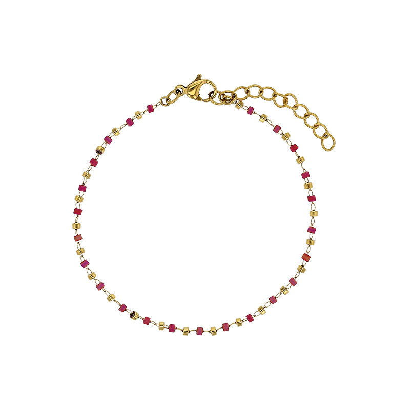 Bracelet orné de perles de verre rose et boule en acier doré