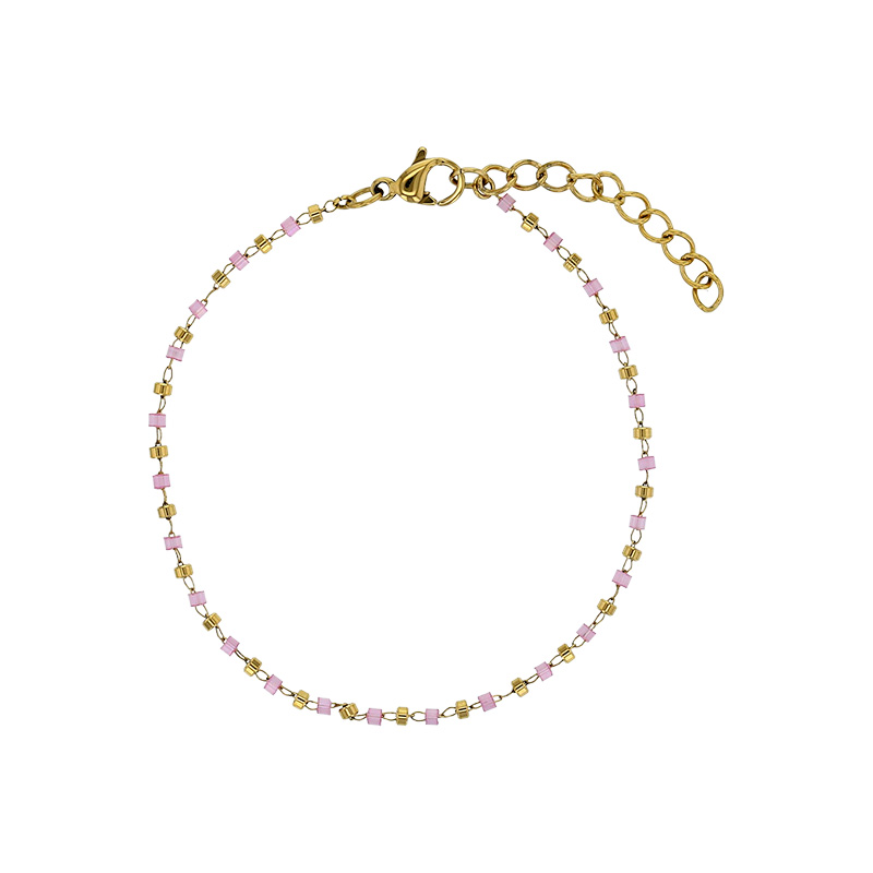 Bracelet orné de perles de verre rose et boule en acier doré
