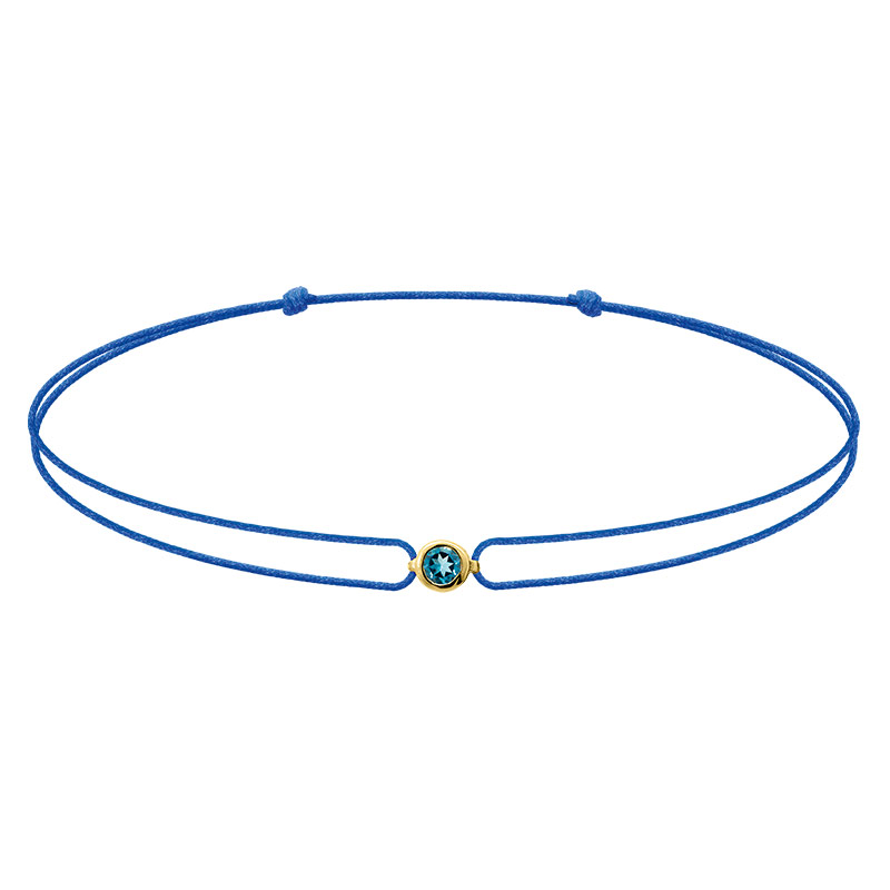 Bracelet réglable topaze london blue sertie clos, cordon nylon bleu roi, Or 375/1000