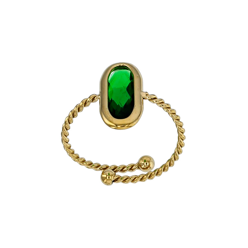 Bague réglable torsadée ornée d'un ovale en verre facetté rouge, acier doré