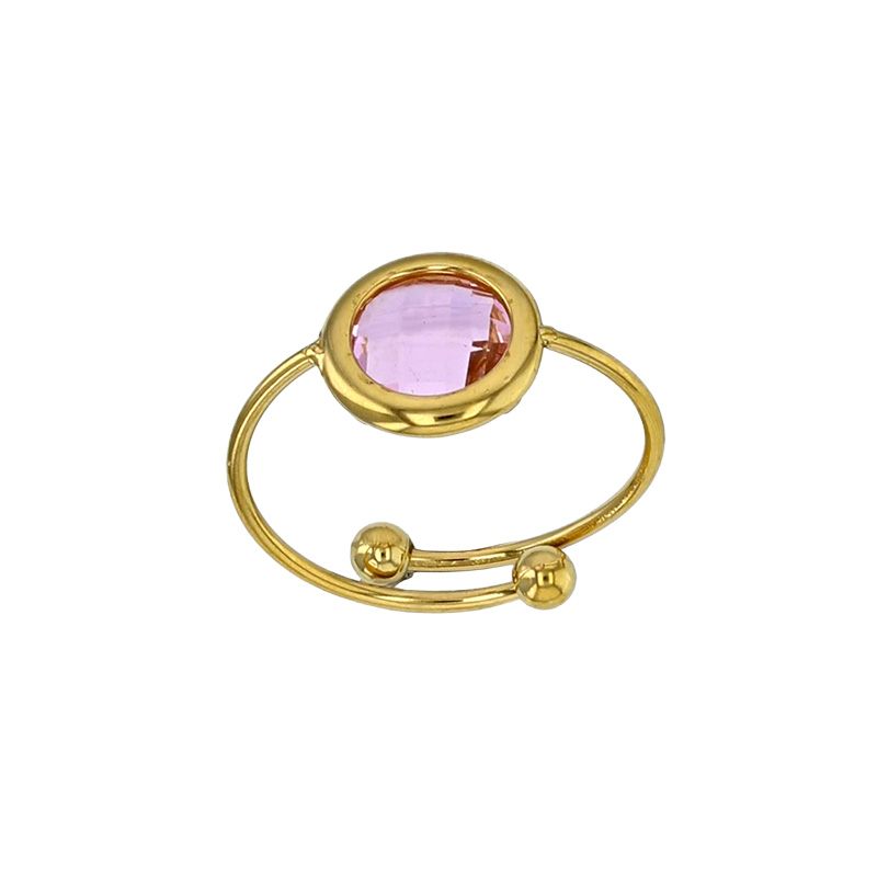 Bague réglable ornée d'un rond en verre facetté bleu marine, acier doré