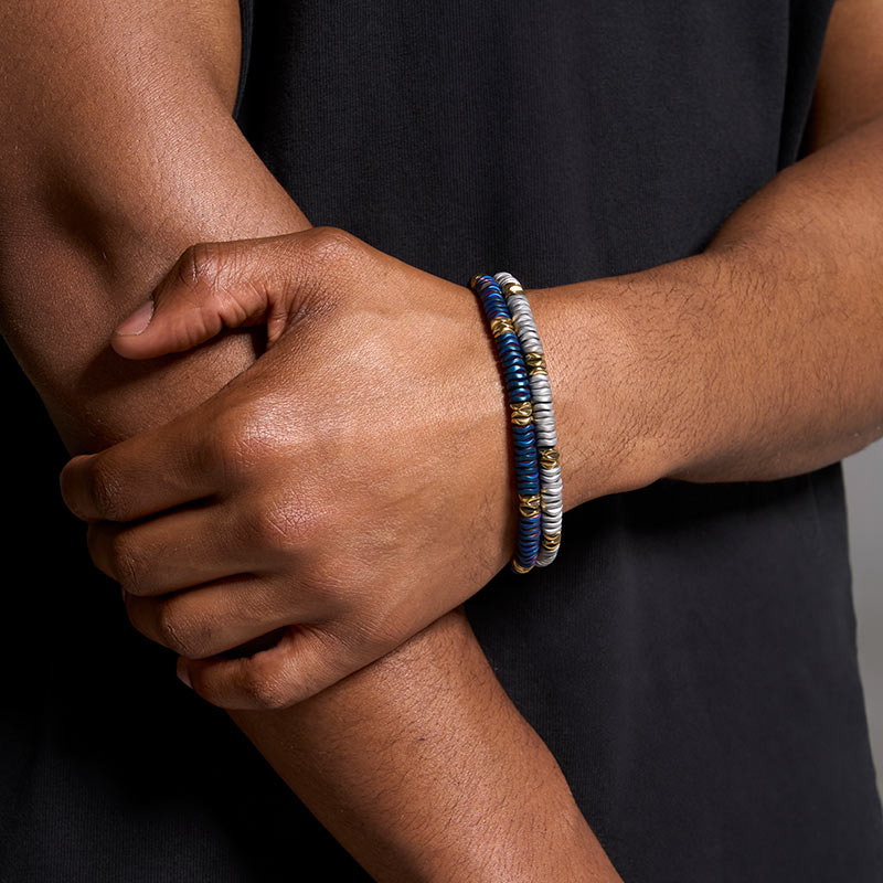 Bracelet en acier et hématites bleues et dorées